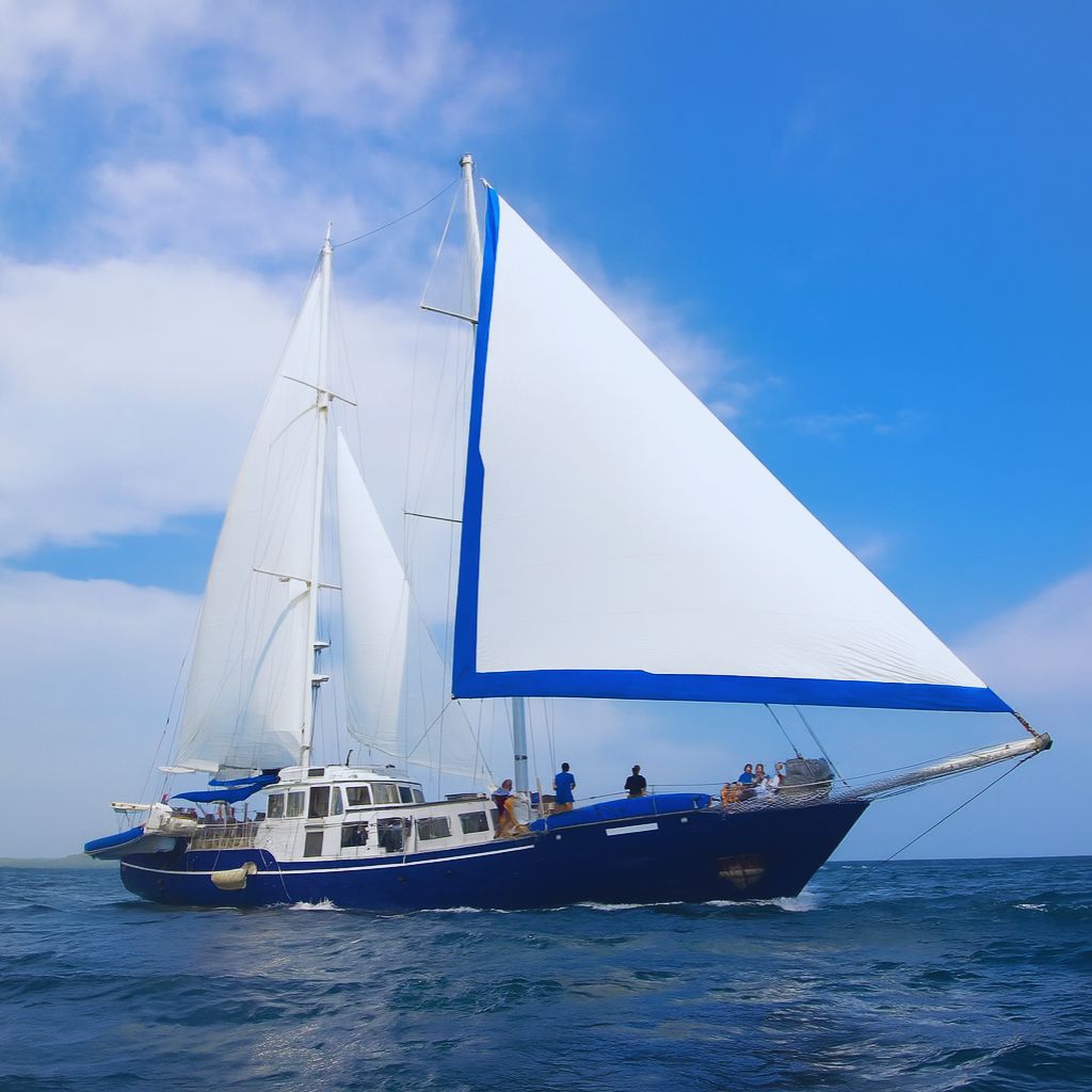 BEAGLE Galapagos Cruise catamaran on the open ocean under blue skies during a September trip with Cruises to Galapagos Islands