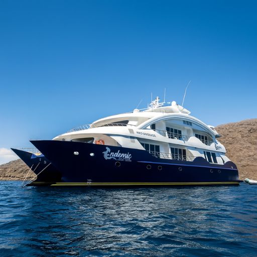 Endemic Galapagos Cruise yacht anchored in beautiful weather during a luxury Galapagos Islands journey with Cruises to Galapagos Islands