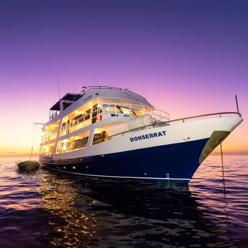 Monserrat Galapagos Cruise anchored in tranquil waters during a Galapagos Islands adventure with Cruises to Galapagos Islands in perfect weather