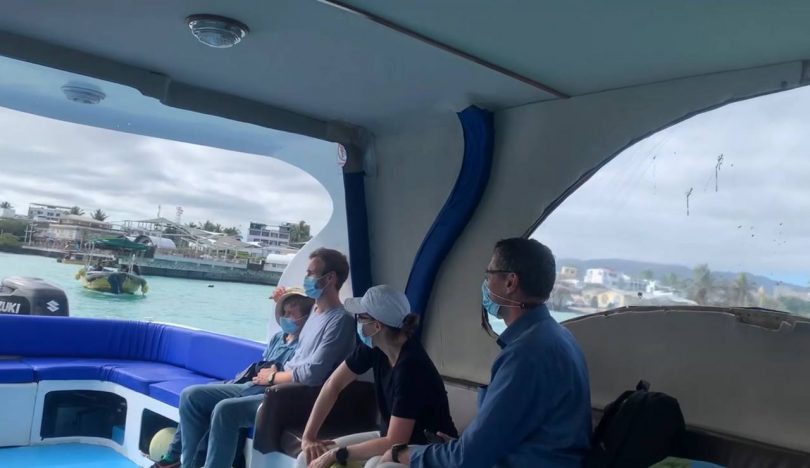 Tourists travelling by boat through the Galapagos Islands during a July cruise adventure with Cruises to Galapagos Islands